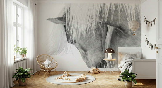 Whispers of Grace wallpaper mural of two white horses nuzzling above a rattan chair in a Scandinavian kids room
