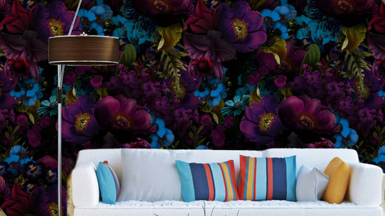 Gothic Dark Moody Florals wallpaper mural in purple and blue behind a white sofa with striped cushions