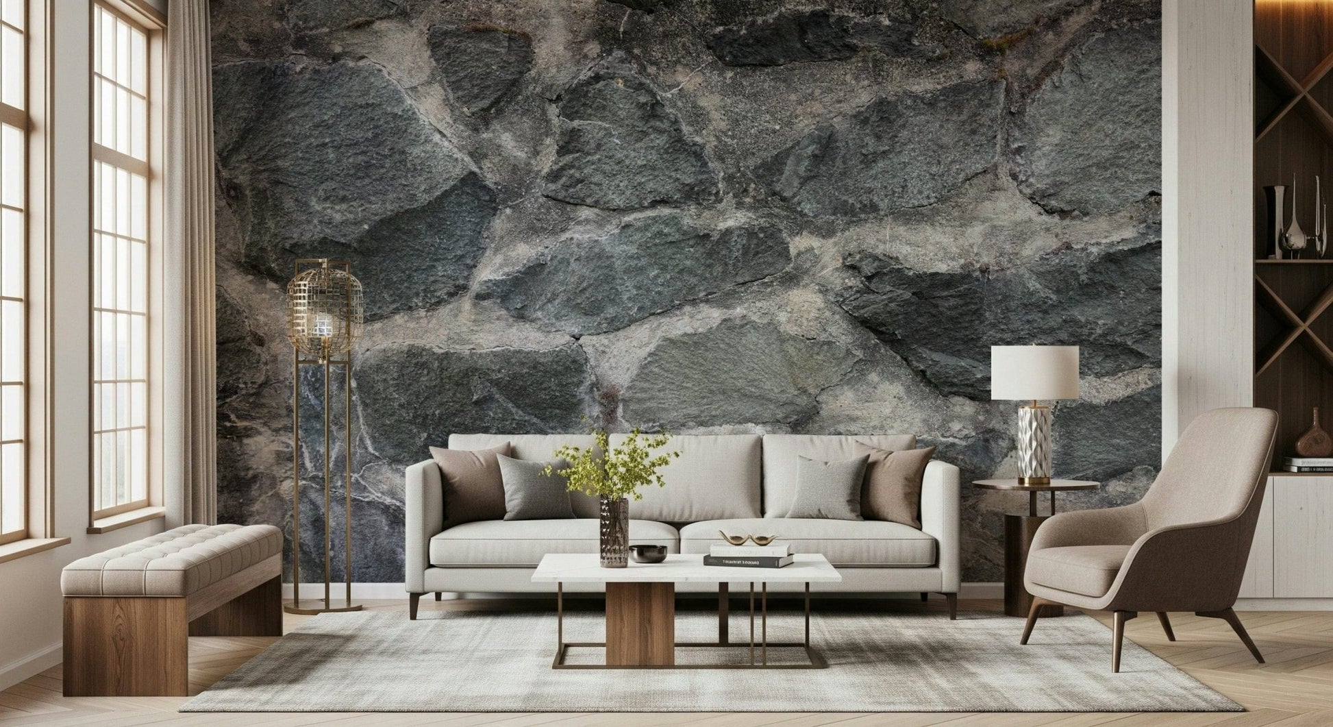 Granite Blocks wallpaper mural of grey stone wall behind a cream sofa and gold floor lamp in a living room