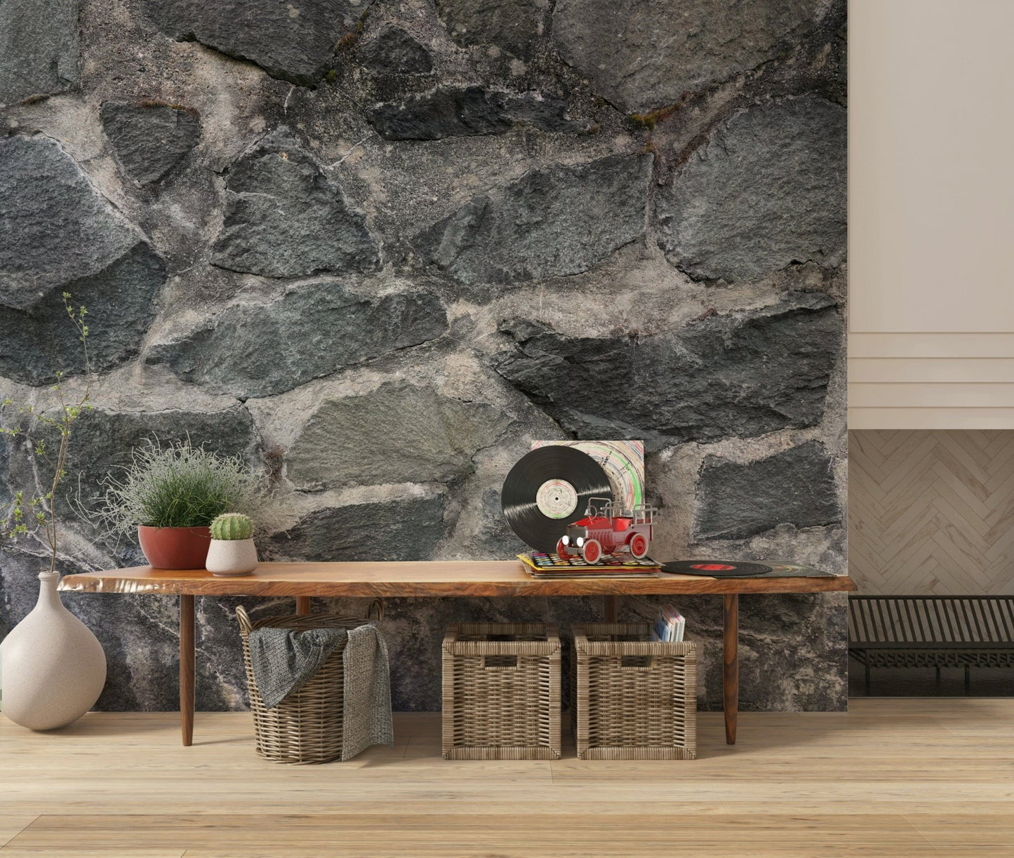 Granite Blocks wallpaper mural of grey stone wall behind a wood bench with vinyl records in an entryway