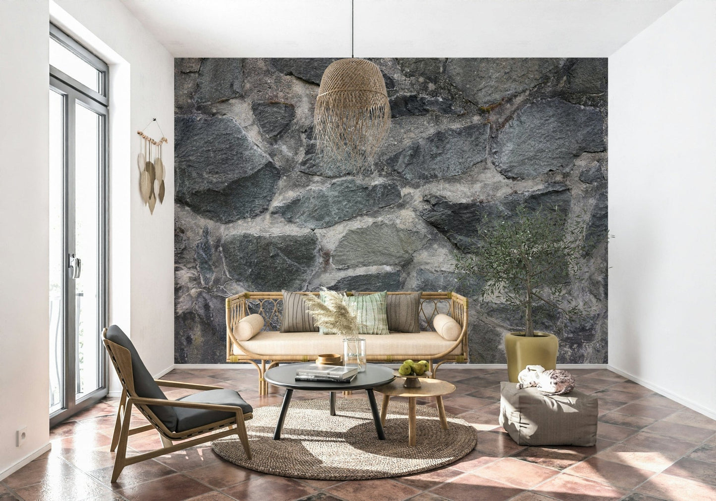 Granite Blocks wallpaper mural of grey masonry behind a rattan daybed and woven pendant over terracotta floor