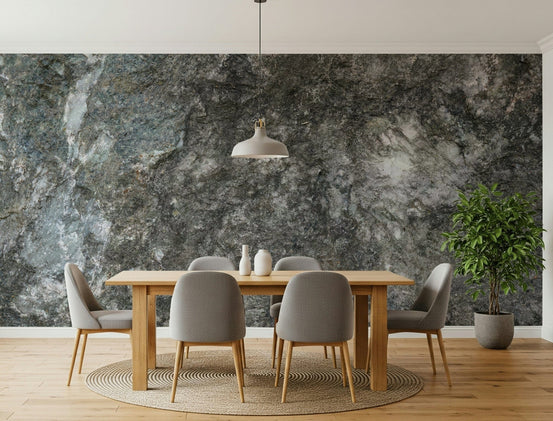 Granite depths wallpaper mural behind a light wood dining table with gray chairs and a white pendant