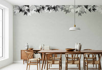 An artistic abstract foliage mural on minimalist wallpaper.