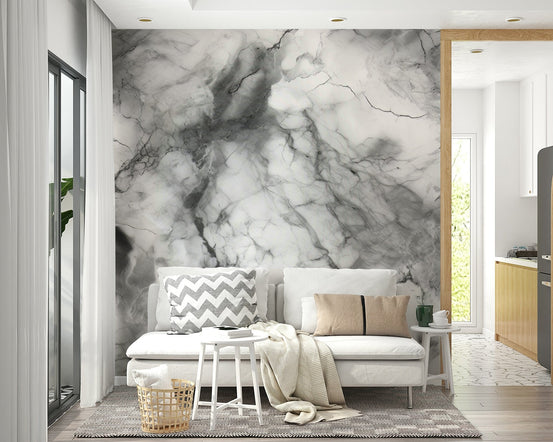 Gray Marble Texture wallpaper mural in white veined marble behind a white sofa with chevron and tan pillows