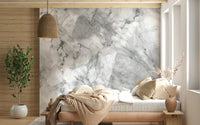 Marble-inspired wallpaper with flowing gray veins and soft stone textures.