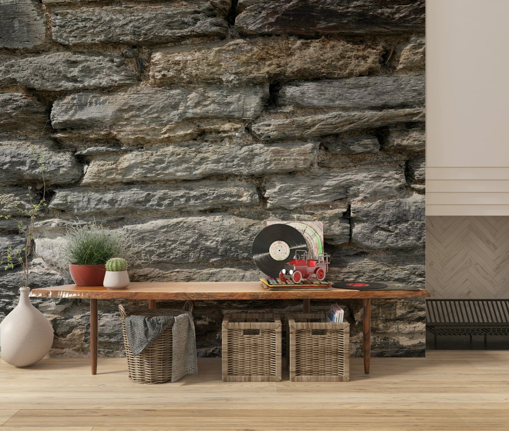 Gray Stone Wall Texture wallpaper mural behind a wood bench with a vinyl record and woven baskets in an entryway