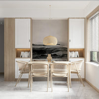 Grayscale Hills wallpaper mural in a dining room with a wood table, rattan chairs and a woven pendant light