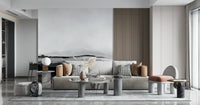 Grayscale Hills wallpaper mural behind a beige sofa in a bright living room with marble round coffee tables