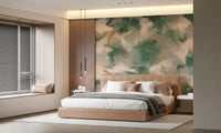Ethereal Brushstrokes wallpaper mural of green paint strokes behind a tan leather bed with wood panel and linear pendants