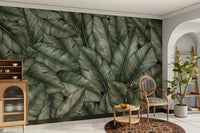 The design features various types of green foliage.

