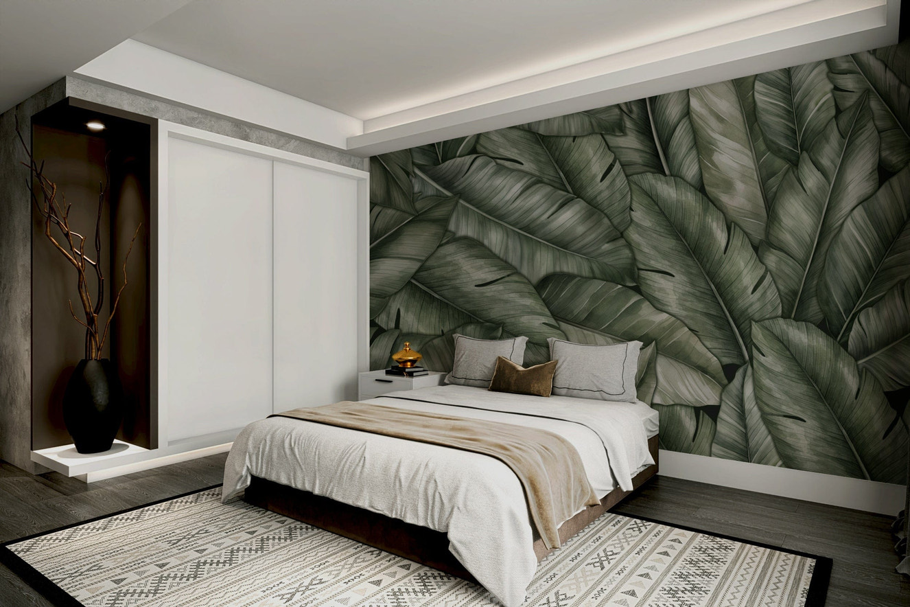 A peaceful wall mural with a tranquil scene of lush leaves.

