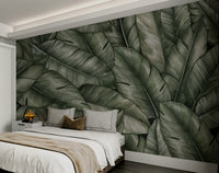 A peaceful wall mural with a tranquil scene of lush leaves.

