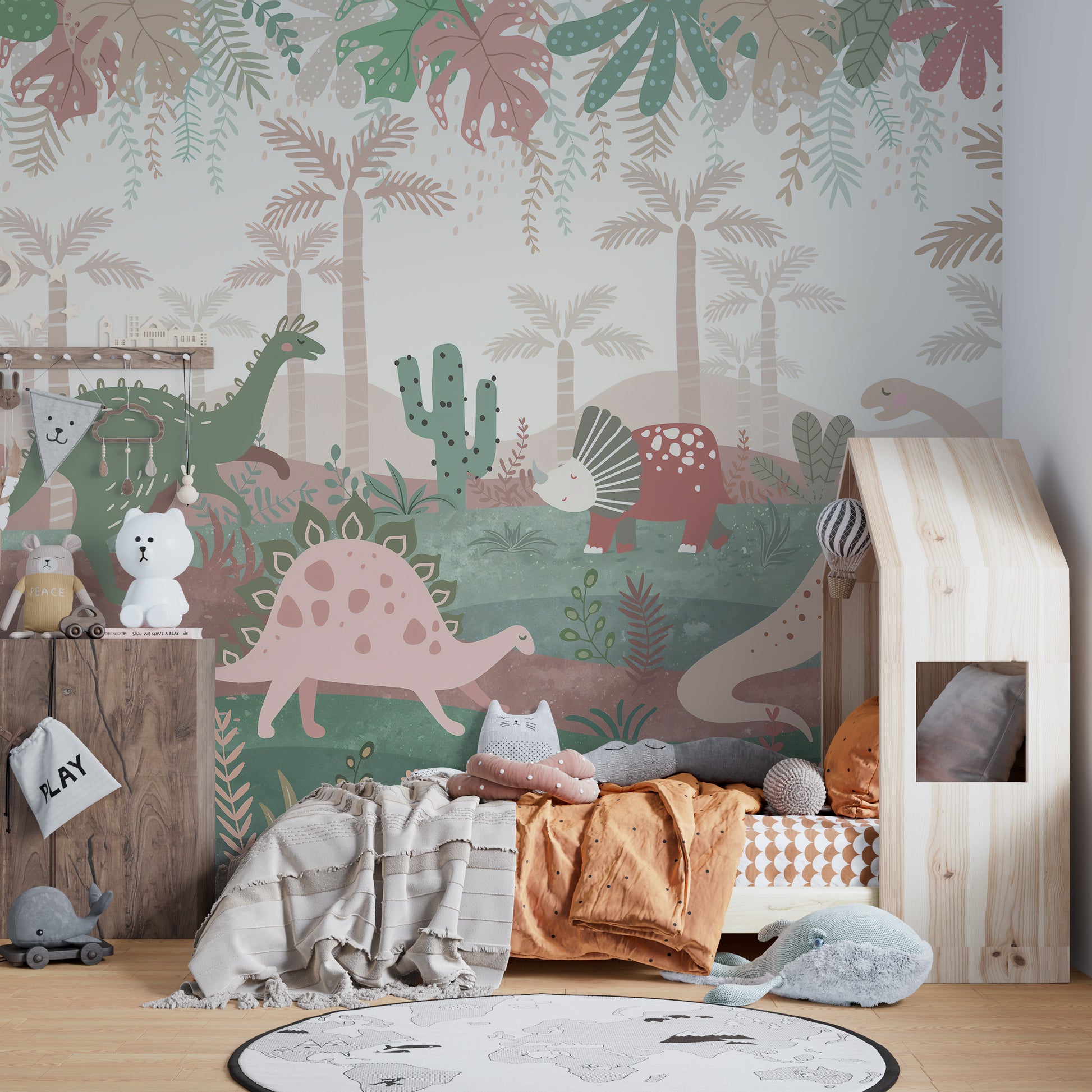 Green & Pink Color Dinosaurs Enjoying wallpaper mural styled as a feature wall behind a dining table and chairs