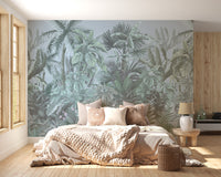 Green Tropical Leaf Forest wallpaper mural styled as a living room feature wall behind a sofa and seating