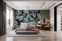 Green White Leaves wallpaper mural styled as a feature wall behind a dining table and chairs in green tones