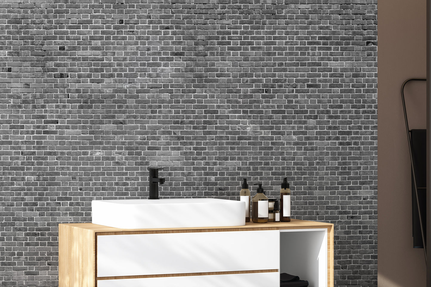 Grey brick wallpaper mural in a modern  bathroom with natural light.