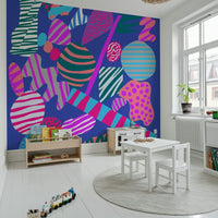 A colorful groovy wallpaper packed with dynamic geometric shapes and retro-style patterns.