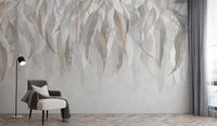 Grunge Gleam wallpaper mural with neutral cascading leaves behind a grey armchair and black floor lamp in a living room