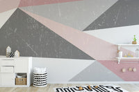 Minimalist geometric plyaroom wall mural featuring distressed soft blue triangles.