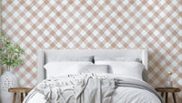 Hand-painted pink gingham wallpaper with a festive design

