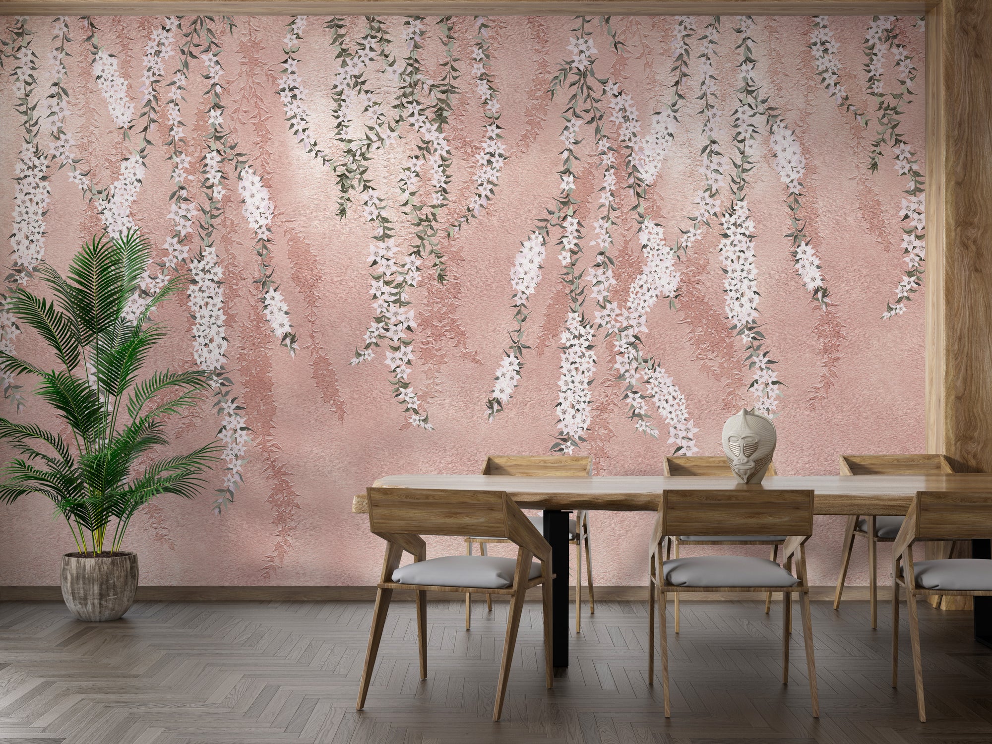 Hanging flower branches pink wallpaper with cascading white blooms behind a wooden dining table and chairs