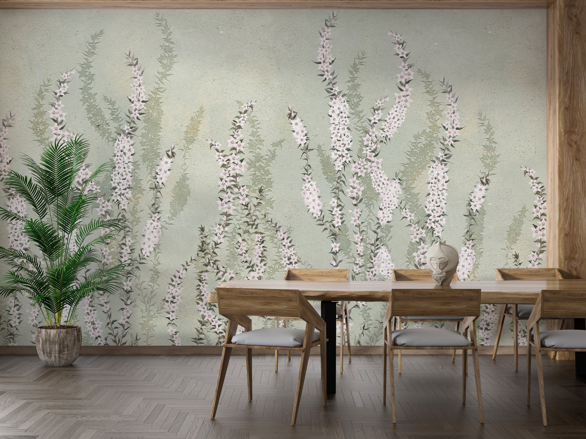 Hanging Flower on Green wallpaper mural of pink florals on sage green behind a wood dining table and potted palm