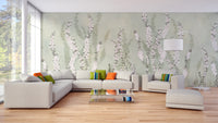 Hanging Flower on Green wallpaper mural with pink blossom spikes on sage green behind a beige sectional and arc lamp