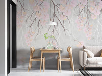Hanging pink flowers wallpaper mural with pink cascading blooms on grey behind a wood dining table and pendant lamp