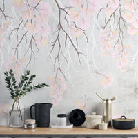 Hanging pink flowers wallpaper mural close-up of pink blooms on grey above a shelf with black and brass vessels