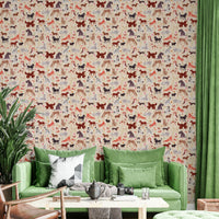 Happy Hounds Dog Doodles wallpaper of illustrated dogs behind a green velvet sofa and wooden coffee table