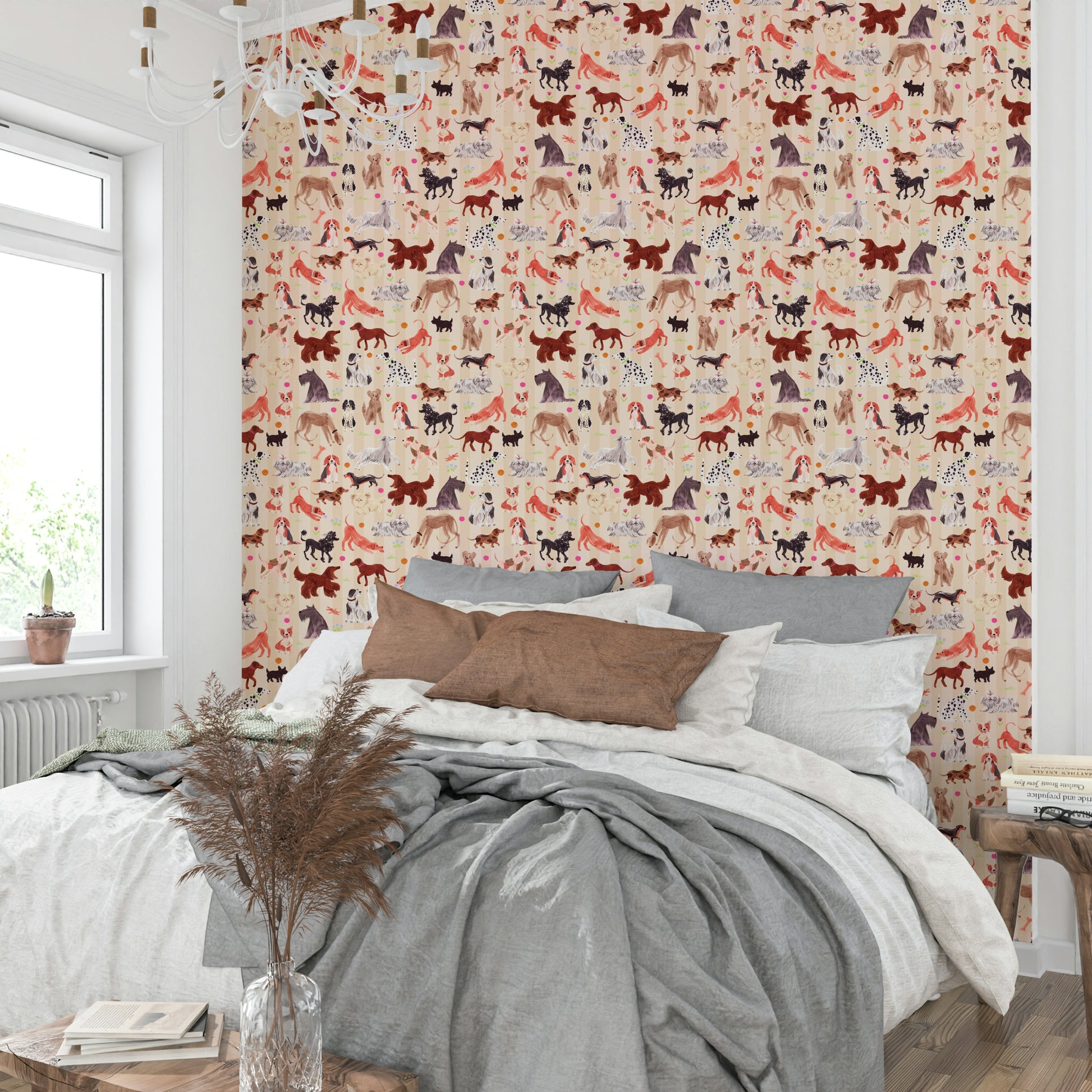 Happy Hounds Dog Doodles wallpaper behind a bed with brown and grey pillows beside a window with pampas grass