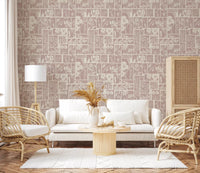 Delicate floral wallpaper with a muted pink background, ideal for a cozy living room.