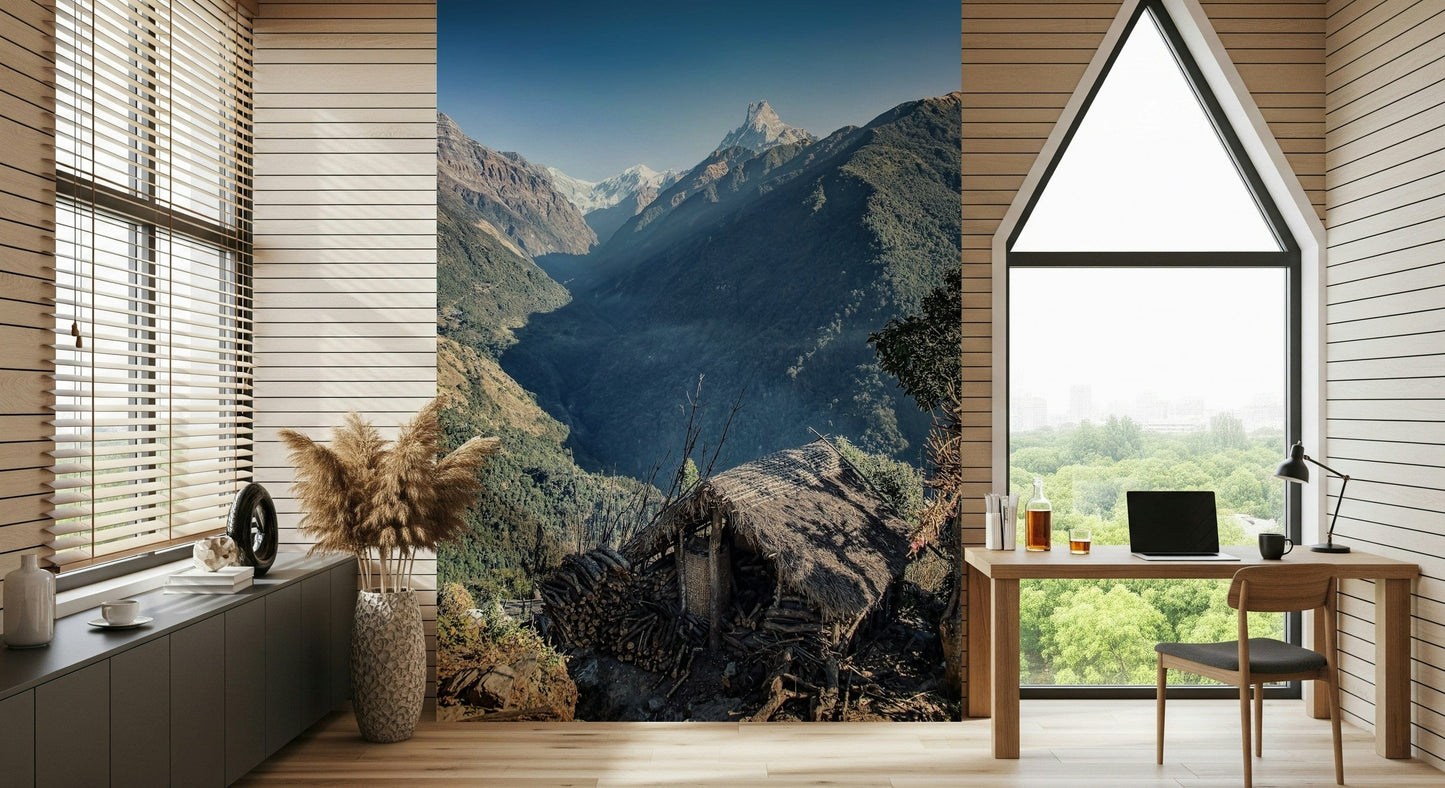 Alpine-style wall mural showing a hut overlooking dramatic mountain ridges and deep valleys.