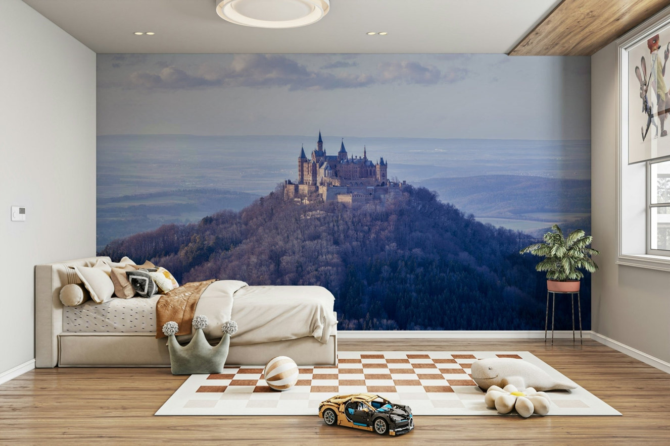 Hohenzollern Castle mural atop a forested mountain wall mural.

