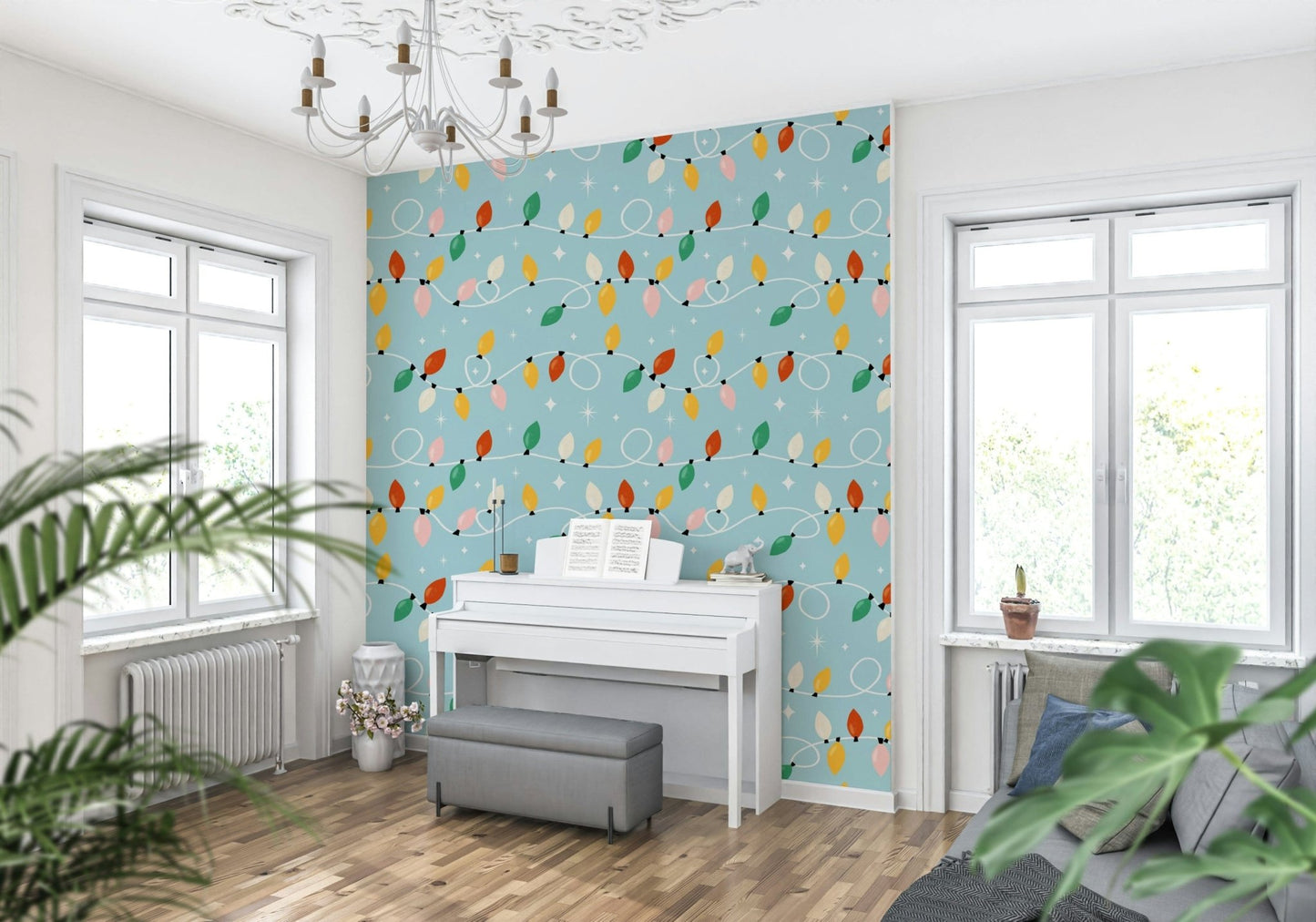 A playful wallpaper design of tangled festive lights in warm and cool tones against a sky-blue background.