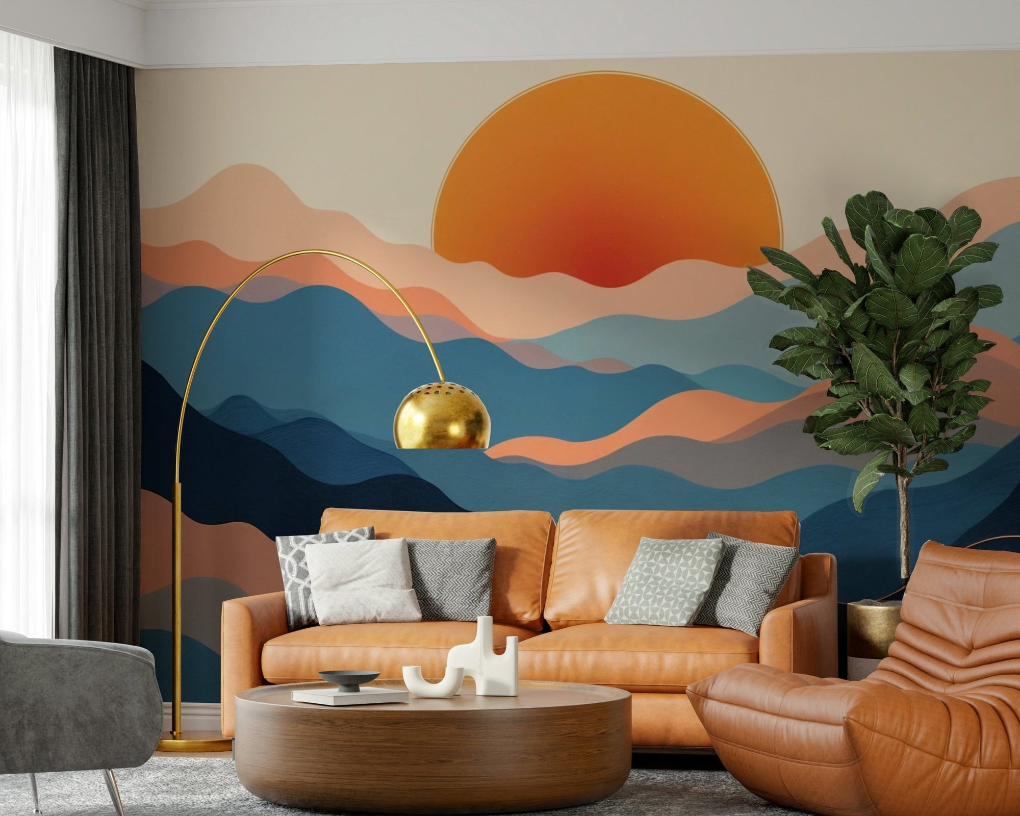 Horizon Layers wallpaper mural, orange sun over layered blue and coral hills behind a cognac leather sofa in a lounge