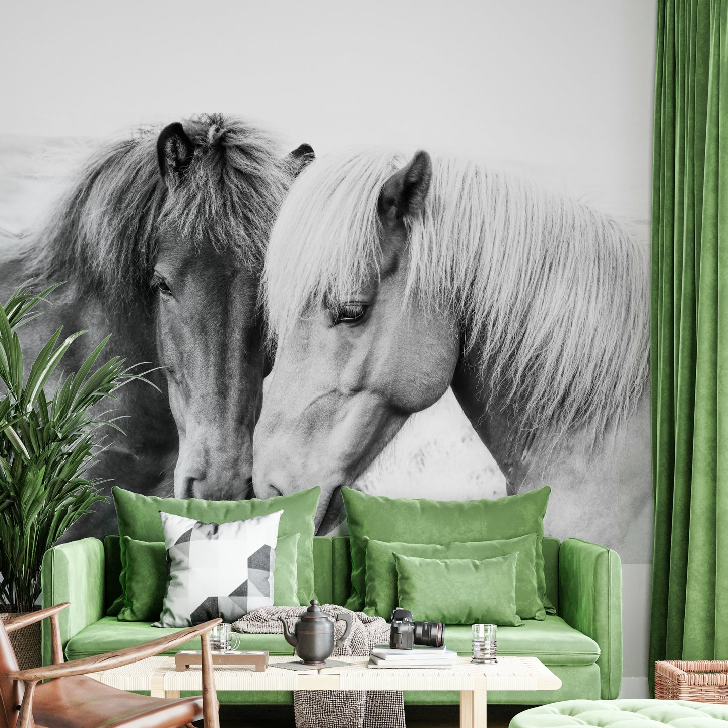 Horse Love wallpaper mural of two horses nuzzling in black and white above a green velvet living room sofa