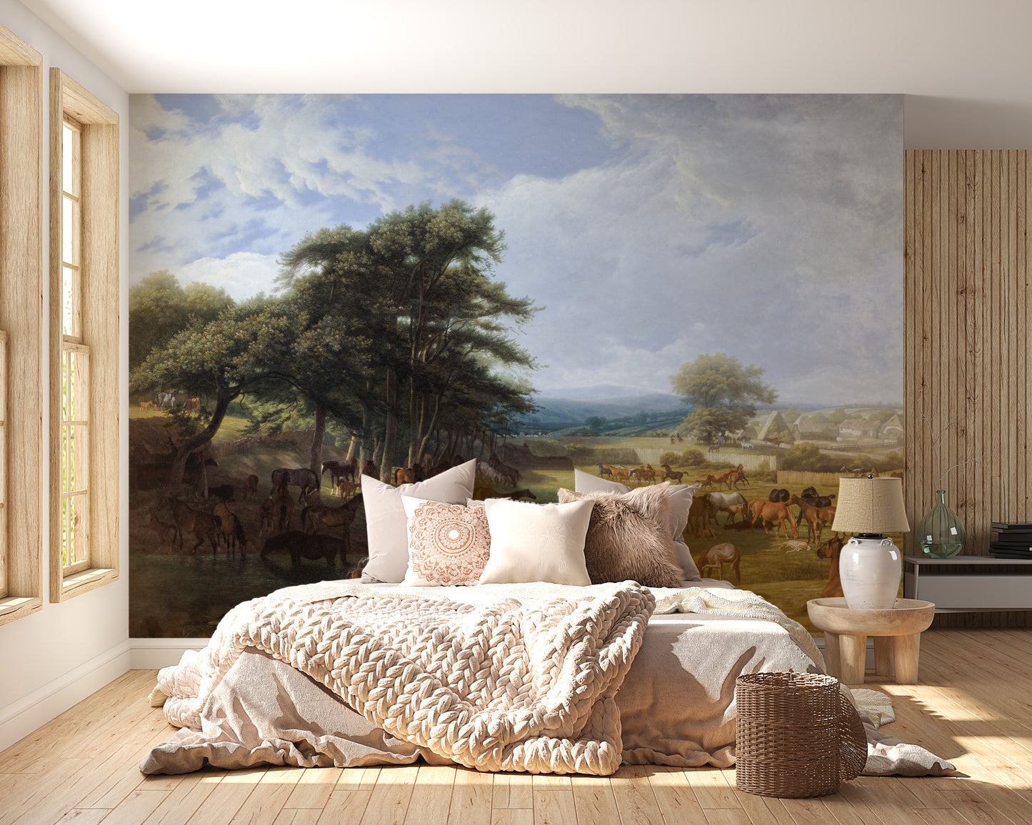 Horse Meadow wallpaper mural with horses grazing under trees behind a cream upholstered bed in a cozy bedroom