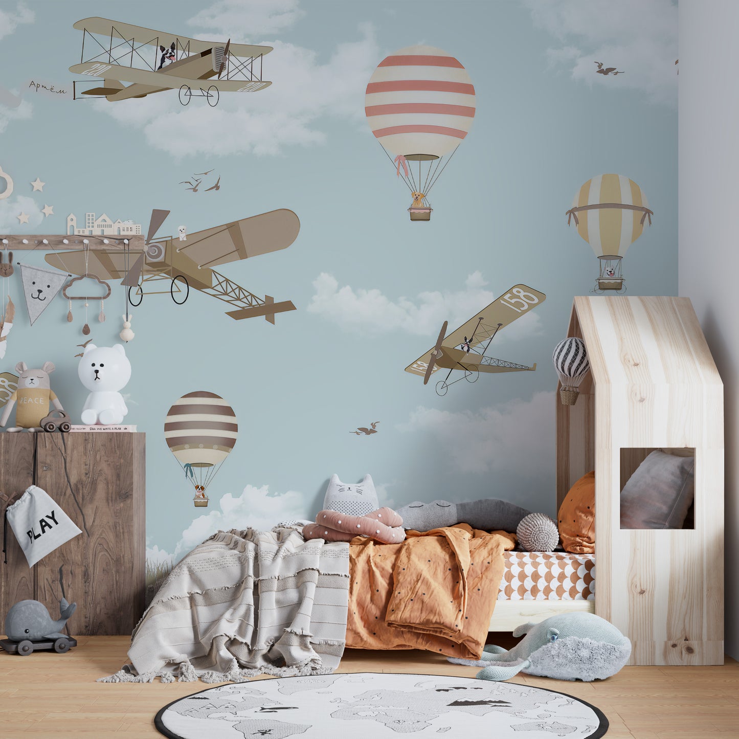 Hot Air Balloons & Planes Fun land wallpaper mural styled as a feature wall behind a dining table and chairs in blue tones