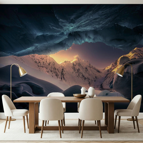 Frozen Kingdom Vista wallpaper mural of a glowing ice cave and sunlit peaks behind a wooden dining table with cream chairs
