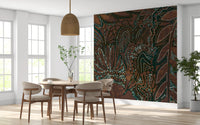 Indigenous Forest wall mural behind a round wood dining table and beige chairs by tall windows