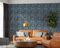 Repeating tropical foliage wallpaper in indigo and slate blue