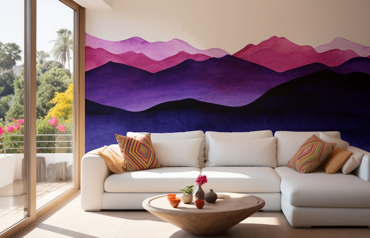Indigo Color Shades Mountain wallpaper mural behind a white sectional sofa with bright pillows in a sunny living room