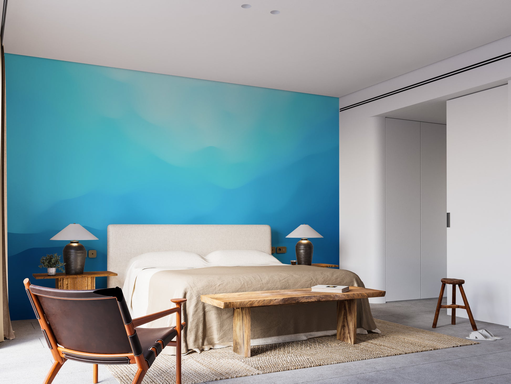 Indigo landscape wallpaper mural styled along a hallway feature wall near a console in blue tones