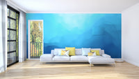 Indigo landscape wallpaper mural as a bedroom feature wall behind the headboard in blue tones