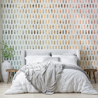 Subtle shimmer of iridescent ovals on soft white wallpaper.

