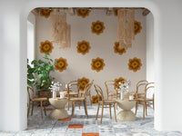 A graceful subtle bloom wall mural in soft, orange tones.