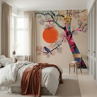 Japanese Summer wallpaper mural with a vivid tree and orange sun behind a white bed with a rust throw