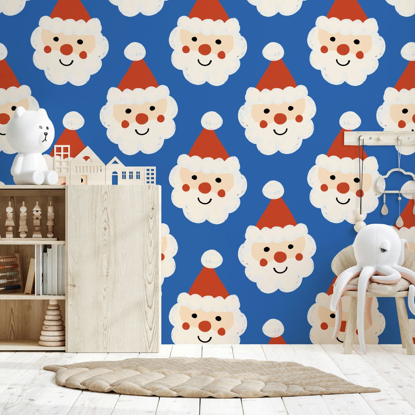 Playful holiday wallpaper with rows of jolly Santa faces wearing red hats on blue.