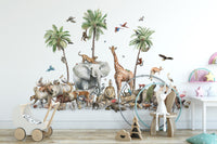 Jungle Safari Animal Birds wallpaper mural above a wooden toy pram and white bunny on a stool in a nursery